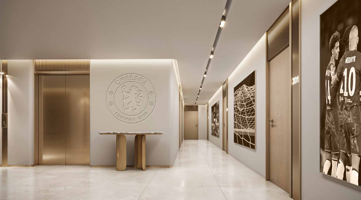Chelsea Residences elevator lobby with Chelsea FC memorabilia and framed photographs